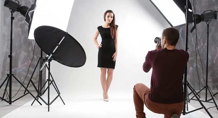 Photographer directing a studio portrait session